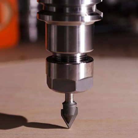 Router bit speed chart reference with a V-groove cutter in a router